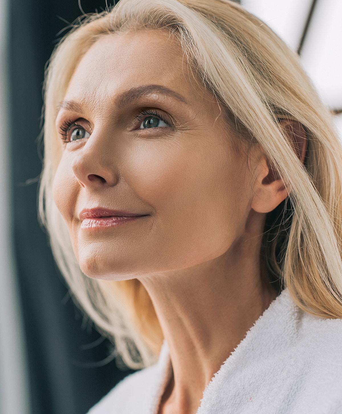 Woman with radiant skin and serene expression.