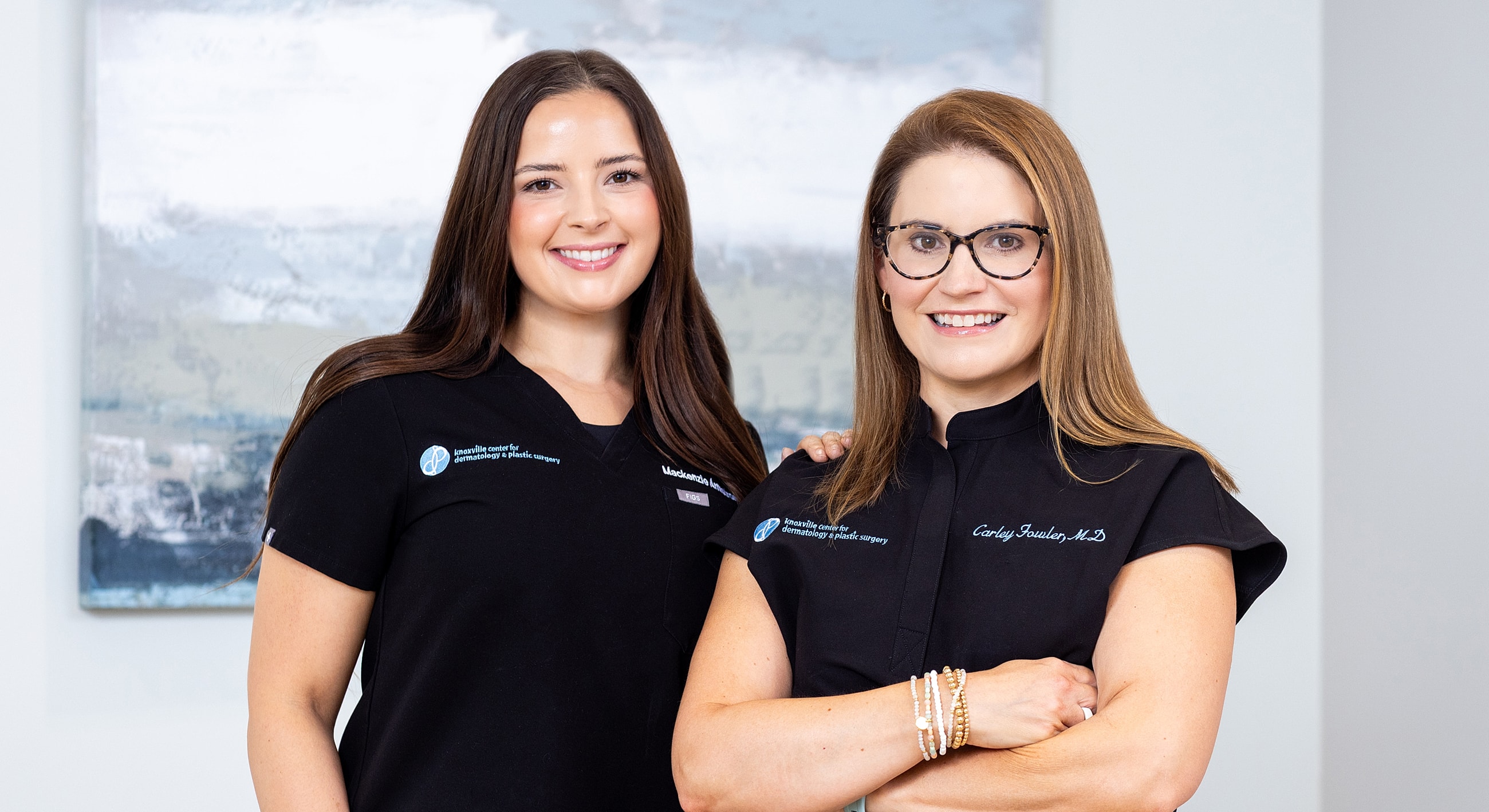 Three healthcare professionals posing together.