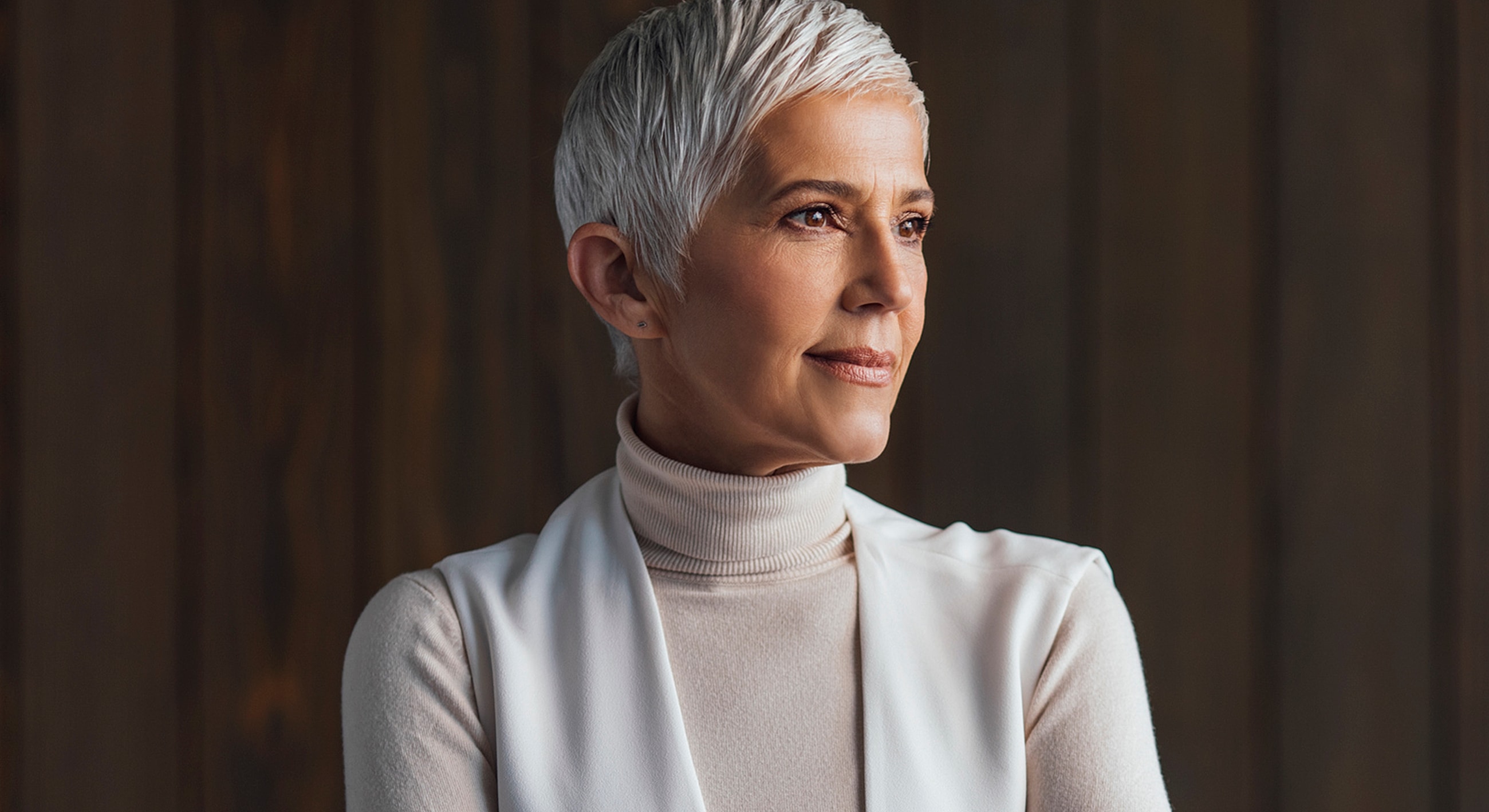 Portrait of a thoughtful woman with short hair.