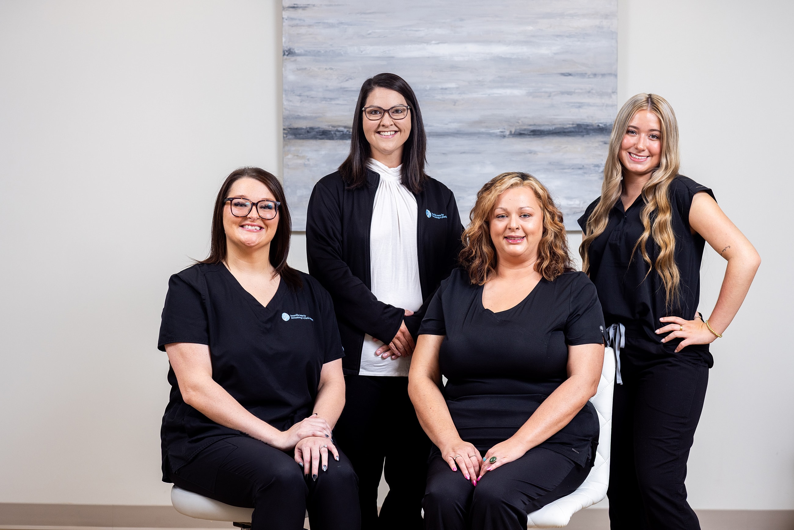 Medical team members posing together in studio.