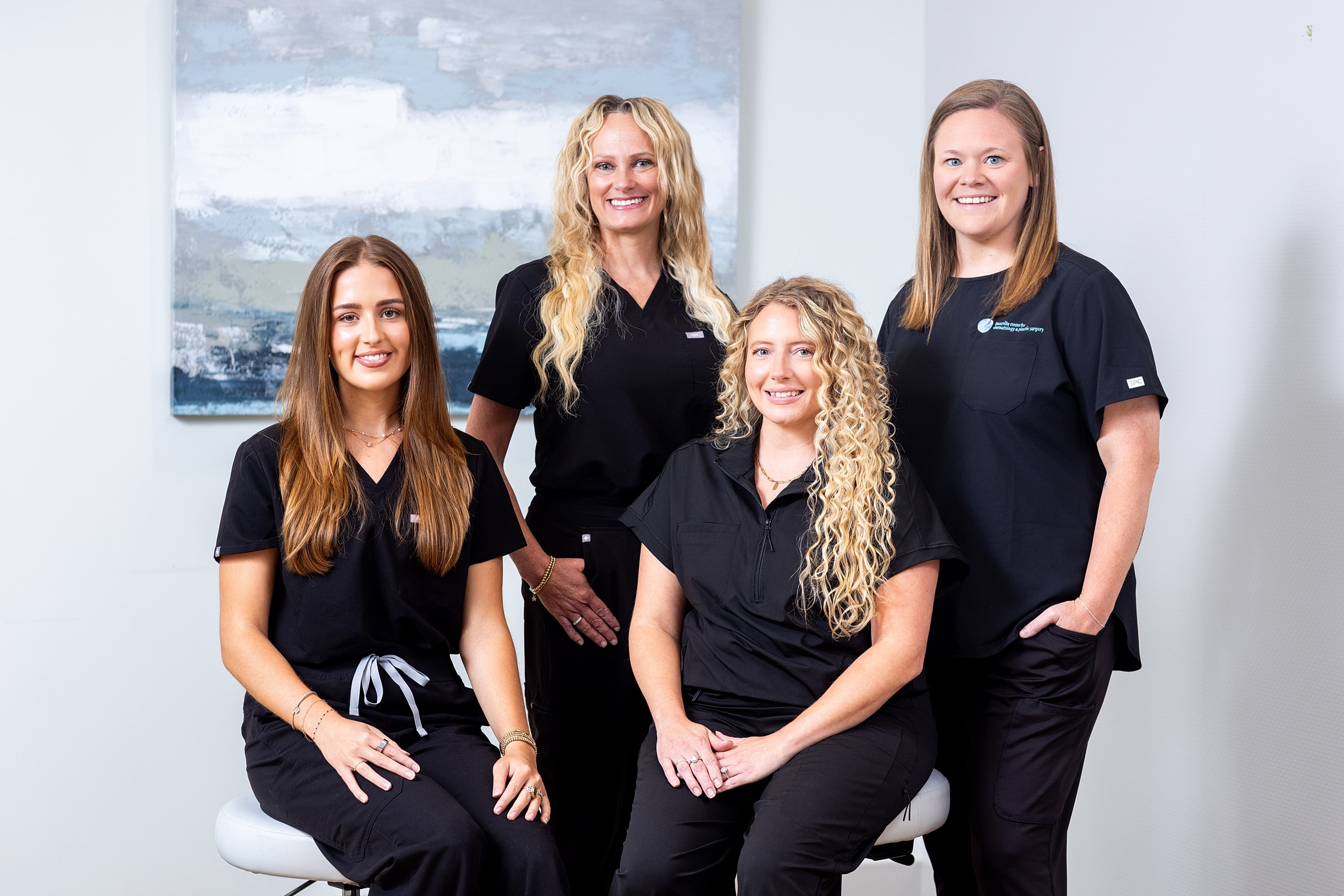 Four healthcare professionals posing for a photo.