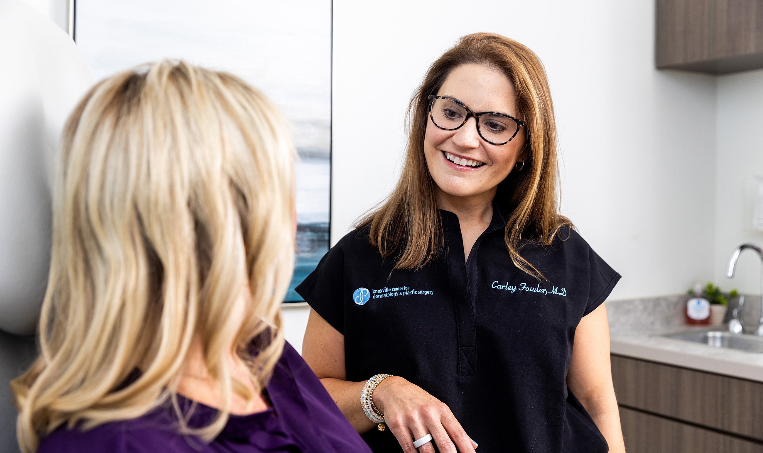 Doctor consulting with a patient in an office.
